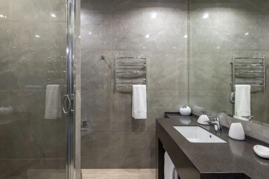 Modern bathroom with a shower enclosure, a major source of household water vapour