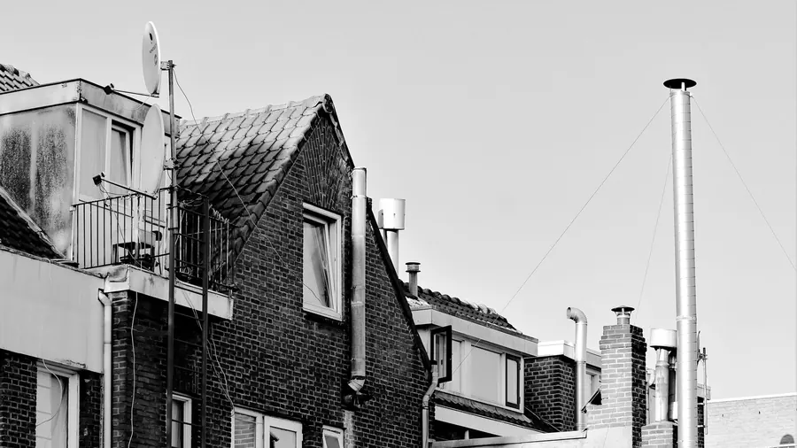 Brick gable, dormer and chimneys on older houses, the kind of roof detail that sets repair costs in Sutton-in-Ashfield