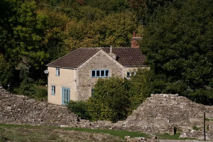 Old cottage hemmed in by mature trees, the kind of tight access that adds to roof work costs around Edwinstowe and Ollerton