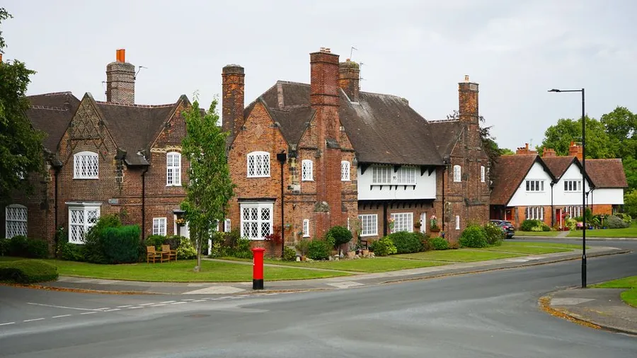 Eaves gutter and soffit line on a traditional brick house showing where roof ventilation enters