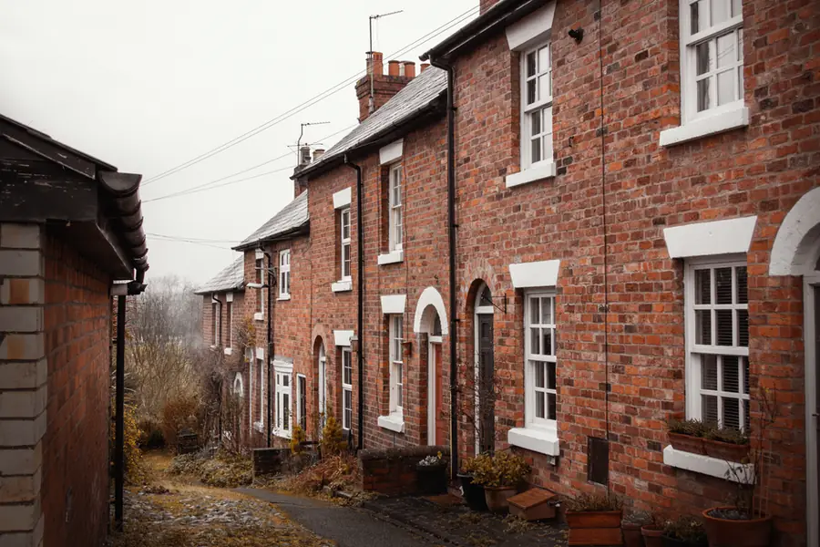 Quiet lane of red brick terraced houses of the kind door-to-door roofing callers work