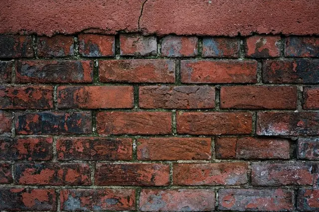 Weathered red brick with perished mortar joints of the kind found on Mansfield chimney stacks