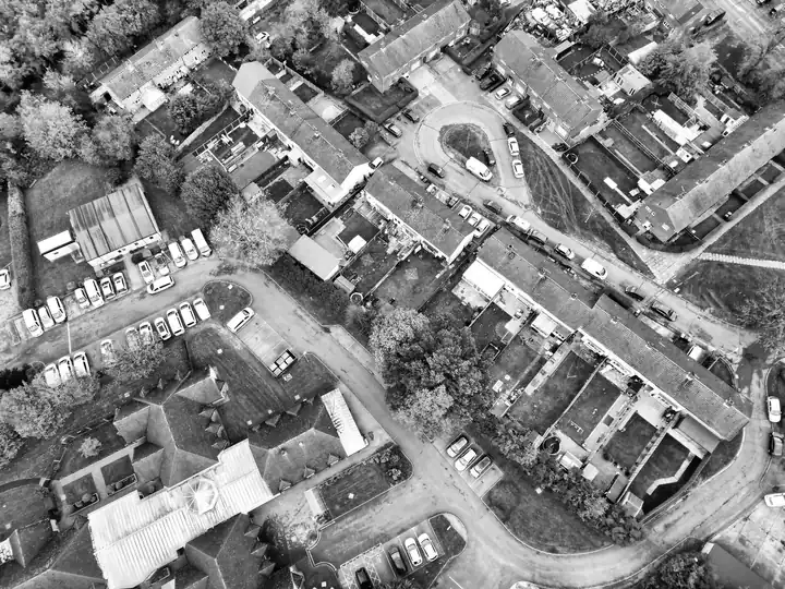 Post-war housing estate with cul-de-sacs and short terraces seen from the air, similar to council-built estates in Ashfield