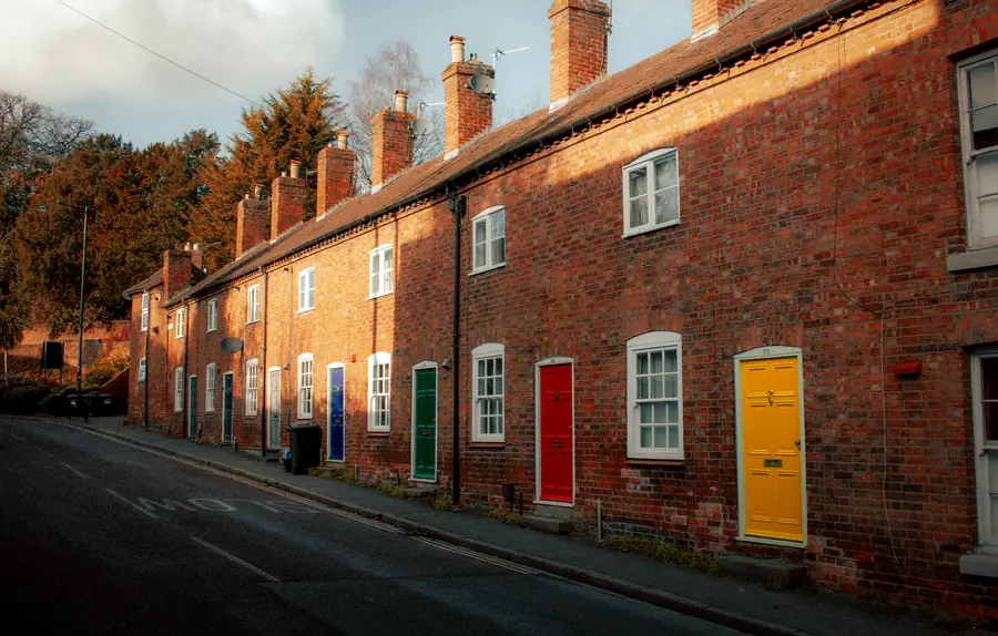 Row of red brick terraced houses similar to older Mansfield streets where emergency roof repair costs vary with access