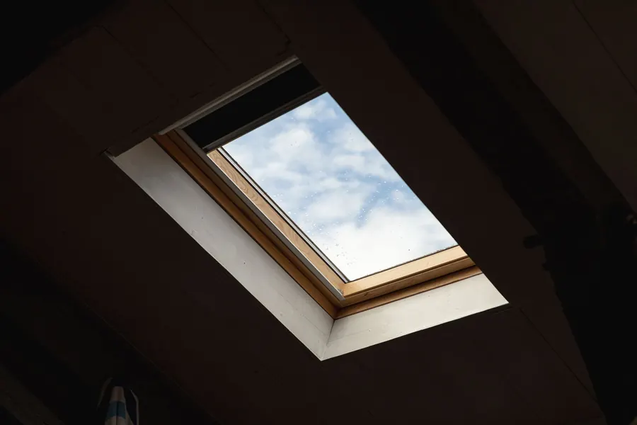 Rooflight set into the ceiling of a flat roofed room, one of the details that adds time and cost to an extension re-cover