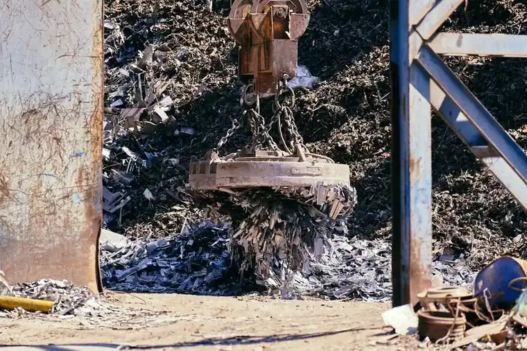 Scrap metal yard with a magnet crane, the trade regulated by the Scrap Metal Dealers Act after roof lead thefts