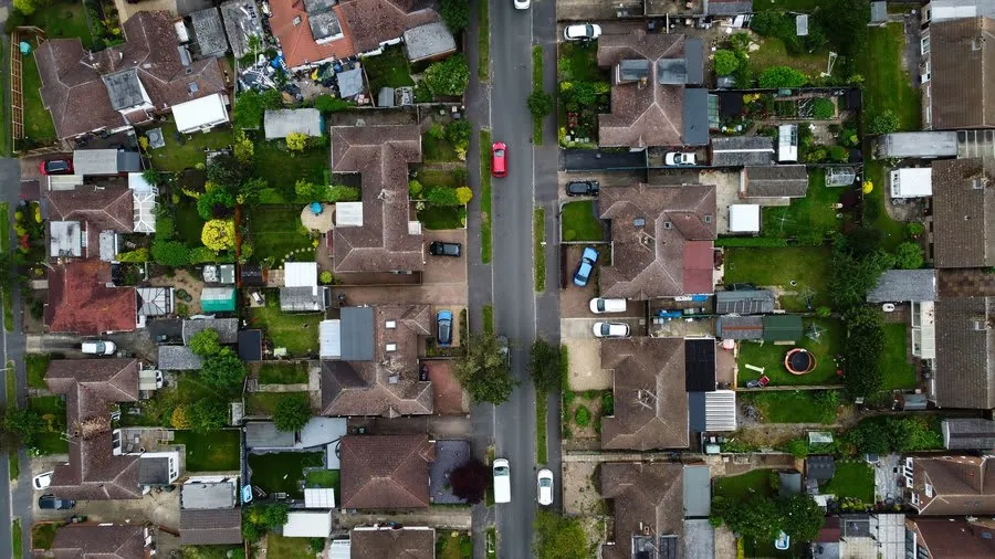 Aerial view of streets of coalfield era housing with tiled roofs across the Mansfield district