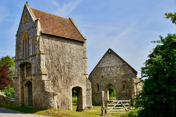 A medieval stone church ruin with a roofless nave and a surviving gabled tower, the kind of ruin found at Annesley near Kirkby-in-Ashfield